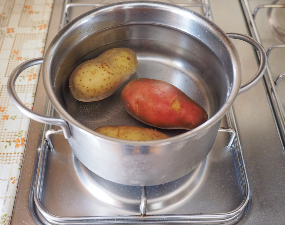 A bag of plain potato chips and a pot of boiling water