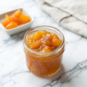 ultra-close-up-view-of-freshly-made-peach-jam-in-a Easy Homemade Peach Jam (No Pectin!)